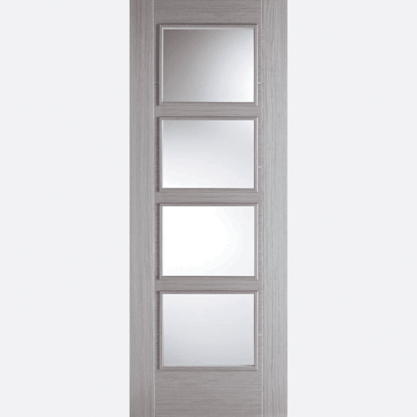 LIGHT GREY VANCOUVER GLAZED 4L BESPOKE SIZES AVAILABLE Four clear glazed panels are framed in a tasteful pre-finished Light Grey shade, with raised moulding on both sides of this door design.